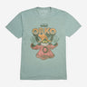 A light green t-shirt featuring a graphic of Orko from the animated series Masters Of The Universe