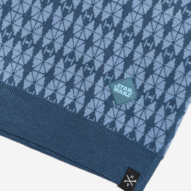 Close up of the polos hem fabric with 'Star Wars' logo and brand label on a white background