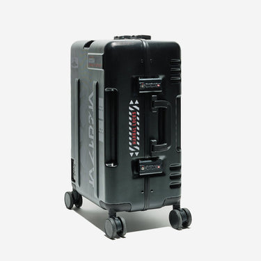 Black suitcase with visible brand logo on a white background