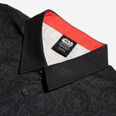 A close up button up black shirt with red details in a star wars imperial geometric pattern 