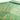 Green shirt with gold embroidery on a white background