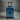 Blue suitcase with X-Men logo on a gray background