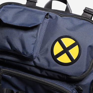 Blue bag with a yellow and black circular emblem featuring a large 'X'.