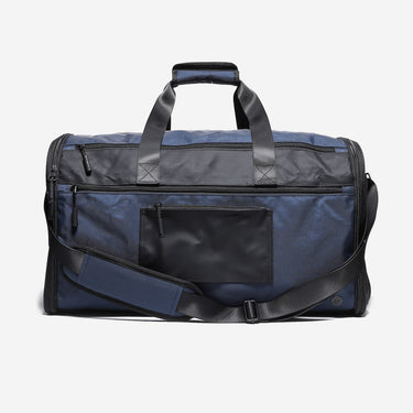 Blue duffel bag with black accents on a white background