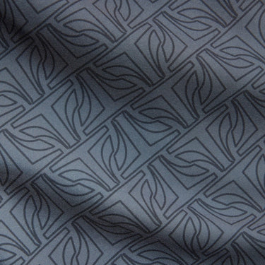 Close-up of gray fabric with a subtle mandalorian pattern