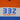 Close-up of 332 Company Colorblock Sweatshirt with orange, white, and blue panels and screen printed art on front.